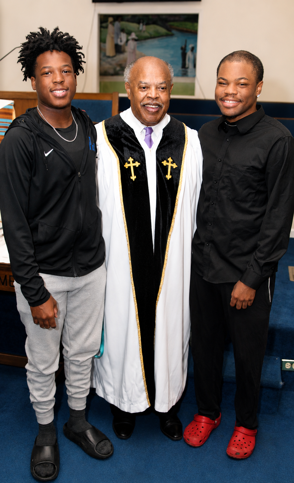 Reverend David Simmons pictured with his two sons
