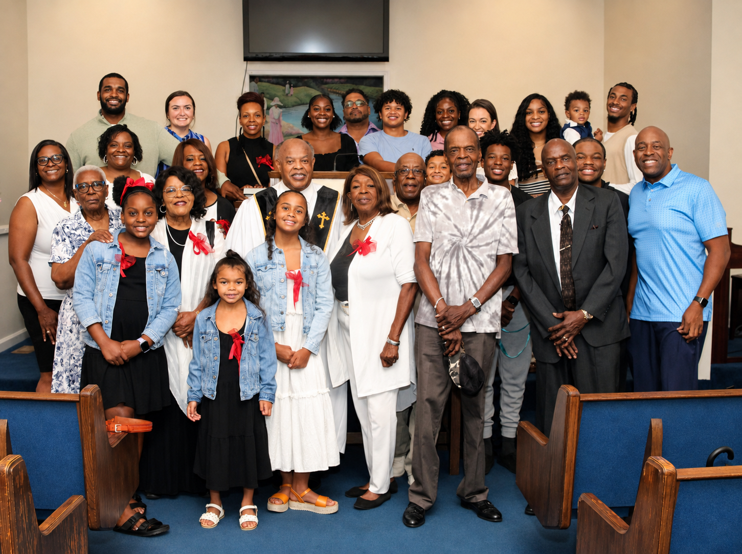 Reverend David Simmons posing for a big family photo
